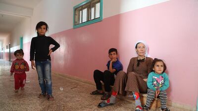 A displaced Kurdish family who fled their home town of Ras al-Ain city take temporary shelter in a school building at Tal Tamr town, northeast of Syria. Turkey has launched an offensive targeting Kurdish forces in north-eastern Syria, days after the US withdrew troops from the area. EPA