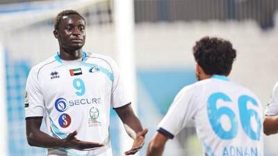 Baniyas' Andre Senghor, left, receives congratulations from teammates after the victory over Al Wasl on Sunday night.