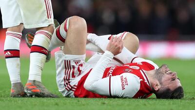 Arsenal's Sead Kolasinac reacts after sustaining an injury from a challenge from Manchester City's Rodri. Reuters
