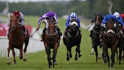 Ryan Moore rides The Gurkha, in purple, to a win in the Qatar Sussex Stakes from Galileo Gold and Frankie Dettori, left, at Goodwood on July 27, 2016 in Chichester, England. lan Crowhurst/Getty Images