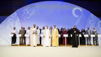 Sheikh Mansour bin Zayed, Deputy Prime Minister and Minister of Presidential Affairs, and Sheikh Nahyan bin Mubarak, Minister of Culture, Youth and Community Development stand with the recipients of the Khalifa Award for Education. Christopher Pike / The National