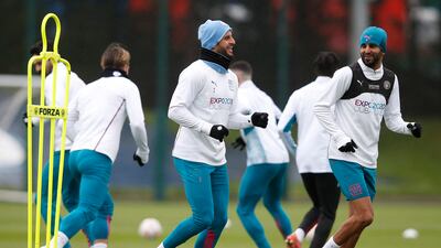 City's Kyle Walker talks with Riyad Mahrez at training. Reuters