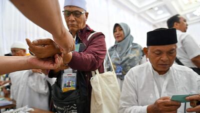 Pilgrims undergo identity checks in Banda Aceh. AFP