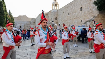 A scout band performs as the Greek Orthodox Patriarch of Jerusalem, Theophilos III, arrives at the Church of the Nativity in Bethlehem. Reuters