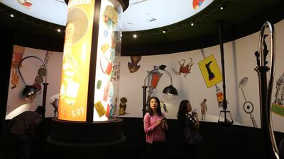 Where the past meets the present. A quintessential French antique circular poster display hangs down from the ceiling, showing off petite Hermes bags. Meanwhile modern lamps reach towards the ceiling from the floor. Pawan Singh / The National