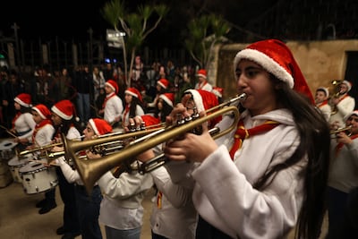 A Syrian scouts band performs after Christmas Eve mass at The Church of the Sacred Heart of Jesus in the port city of Latakia. AFP