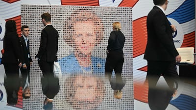 Delegates look at a montage creating an image of former Conservative prime minister Margaret Thatcher on the third day of the annual Conservative Party conference in Manchester, north-west England. AFP