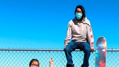 Jacque Thorpe and Terrill Humeyestewa, who helped create the skate park, take a break from skateboarding. AP