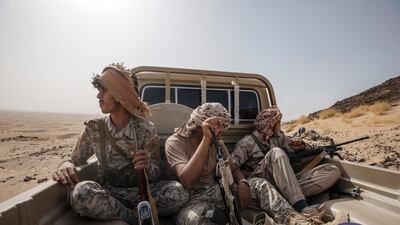 Yemeni fighters leave after clashes with Houthi rebels on the Kassara front line near Marib. AP