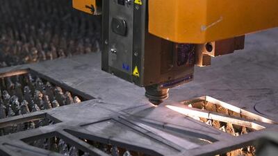 The Mussaffah factory has machines for everything to do with industry: to lathe, laser cut and bend metal. Above, a laser-cutting machine. Silvia Razgova / The National