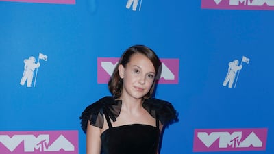 Millie Bobby Brown, wearing a black jumpsuit by Rosie Assoulin, attends the MTV Video Music Awards in New York on August 20, 2018. EPA
