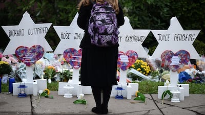 A woman stands at a memorial outside the Tree of Life synagogue after a shooting there left 11 people dead in the Squirrel Hill neighbourhood of Pittsburgh on October 27. AFP