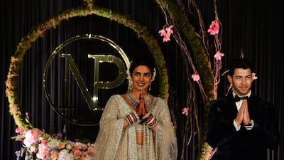 Newlyweds Priyanka Chopra, 36, and Nick Jonas, 26, pose for a photograph during a reception at a hotel in New Delhi on December 4, 2018. Photo: AFP
