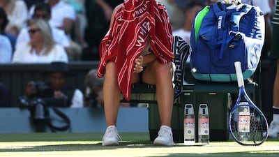Linda Noskova sits in her chair under a towel on way to losing the second set. Getty Images