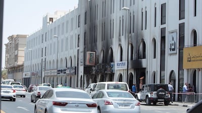 Civil Defence said the fire began at 12.25pm in the cars parked near Abu Baker Al Siddique Metro station in Deira. Ruel Pableo for The National