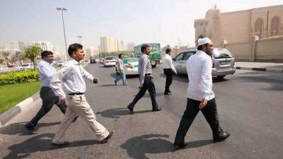 Tenants left homeless after a fire at Al Tayer Tower visit Al Diwan Al Ameri Palace, right, to seek help.
