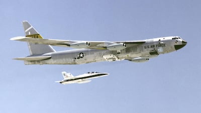 A B-52 Bomber accompanied by A F-16 Fighter. Getty Images