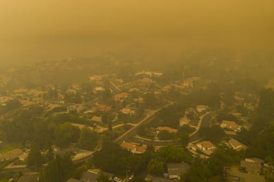 Smoke over neighbourhoods in Monrovia, California, September 13. California wildfires that have already incinerated a record 2.3 million acres this year and are expected to continue till December. David McNew/Getty Images/AFP