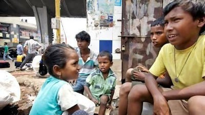The dabbawalas have joined a programme that helps feed street children. Kuni Takahashi for The National