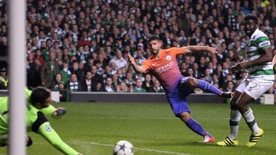 Manchester City’s Sergio Aguero, centre, shoots towards Celtic goalkeeper Craig Gordon, left, but the ball rebounds to Manchester City’s Nolito (unseen) leading to their third goal. Oli Scarff / AFP