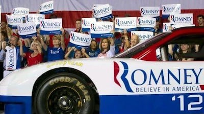 Supporters of US Republican presidential candidate Mitt Romney await his arrival for a campaign rally at the Nascar Technical Institute in Mooresville, North Carolina in August. Saul Loeb / AFP