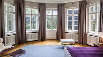 The house’s facade, with its domed cupola topped by a grand statue and imposing arched windows, lives up to such a historic past. Courtesy 16elements Architekturfotografie via Savills International