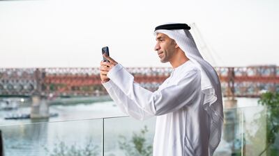 Dr Thani Al Zeyoudi, Minister of Foreign Trade, takes a photograph