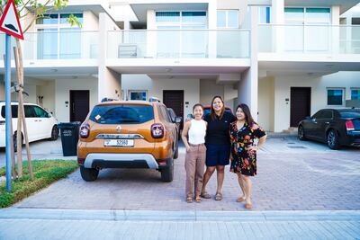 Mechelle Manuel (left) and her sisters Moj (centre) and Leny moved out of a two-bedroom apartment in Town Square, Dubai, after facing a 15 per cent rent increase. They moved further to the city outskirts for better value. Photo: Mechelle Manuel