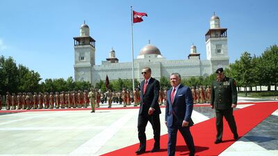 Jordan's King Abdullah II walks with Turkey's president Recep Tayyip Erdogan, left, during a welcome ceremony at the Husseiniya Palace in Amman on August 21, 2017. Pool photo via AP