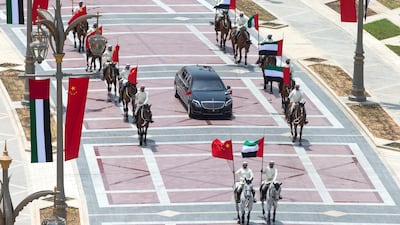 Members of the UAE Armed Forces Cavalry Division escort Mr Xi's motorcade towards the palace entrance. Crown Prince Court - Abu Dhabi