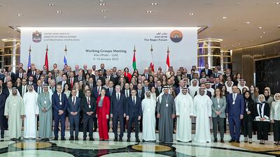 Officials from the UAE, Bahrain, Egypt, Israel, Morocco and the US pose for a photo during the first working groups meeting of the Negev Forum in Abu Dhabi. AFP