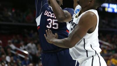 Amida Brimah of the Connecticut Huskies drives with the ball against Wesley Gordon of the Colorado Buffaloes in the first half during the first round of the 2016 NCAA Men’s Basketball Tournament at Wells Fargo Arena on March 17, 2016 in Des Moines, Iowa. Jonathan Daniel/Getty Images/AFP