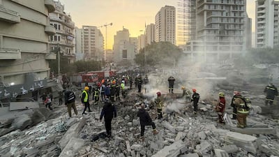 Firefighters at the site of the Israeli air strike in Bachoura. Lebanon said Israel struck central Beirut on March 18 without warning, killing at least six people, as the Israeli army announced it was attacking the country's south. AFP