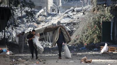 Palestinians displaced from their homes as a result of Israeli raids in Gaza City. Getty Images