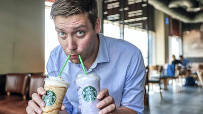 Daniel Sanderson samples the new range of sugar-laden cheesecake frappuccinos at Starbucks, which medics described as an unhelpful arrival in the fight against obesity and diabetes. Victor Besa / The National