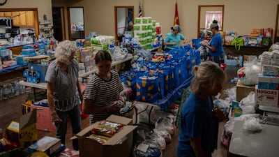 Food for those in need on tables at the Hunt Baptist Church. AFP