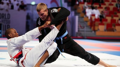 Jose Nduazulu-Ndilu, left, beat Elis Wiklund in the 94kg blue belt division final.
