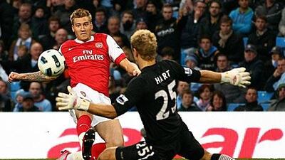 Nicklas Bendtner scores Arsenal’s third.