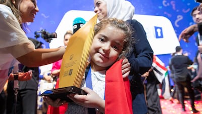 Sham Bakour of Syria with her first-place trophy at the Arabic Reading competition ceremony at Dubai Opera. Ruel Pableo for The National