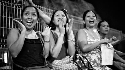 Wives of some of the players react during a semi-finals match.