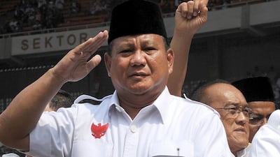 Indonesia's presidential candidate Prabowo Subianto salutes supporters during campaign rally in Jakarta on June 22,2014. Subianto, 62, ordered the abduction of democracy activists in the dying days of dictator Suharto's rule, was once refused entry to the US over rights abuses, and used to be married to one of the strongman's daughters. Romeo Gacad/AFP Photo