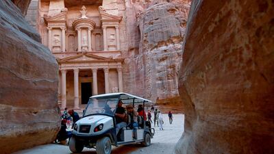 At the ancient city of Petra, Jordan, 10 electric carts have replaced 12 of the more traditional horse-drawn carriages that transported tourists to the historic site. AFP