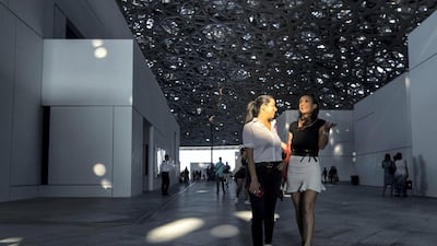 Visitors attend the opening day at the Louvre Abu Dhabi on Saadiyat Island in Abu Dhabi on November 11, 2017. Christopher Pike / The National