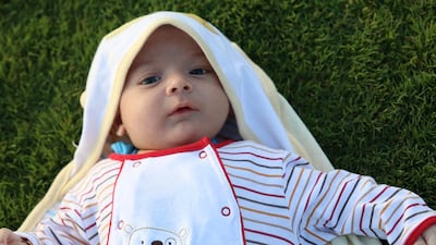 The baby boy needs an expensive genetic blood test and can only drink a special kind of formula milk. Navin Khianey for The National