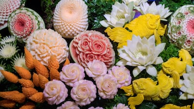 An elaborate display of carved fruits and vegetables is displayed during a fruit and vegetable carving competition in Bangkok. Robert Schmidt / AFP