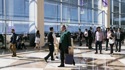 Korn Ferry says average real salaries are projected to move back to positive levels this year. Reem Mohammed / The National