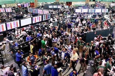 Traders in the crude oil and natural gas options pit on the floor of the New York Mercantile Exchange. Spencer Platt / Getty Images / AFP