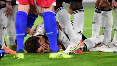 Germany's Leon Goretzka down injured. Reuters