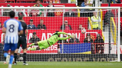 Manchester United goalkeeper Andre Onana is beaten by a shot from Brighton's Joao Pedro. AP