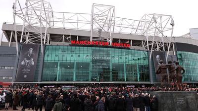 The funeral procession for Sir Bobby Charlton passes Old Trafford. Getty Images